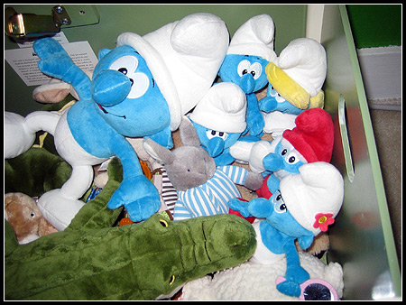 Smurfs in the toy box.